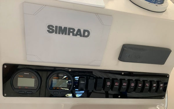Simrad display with digital gauges and a switch panel on a custom dash