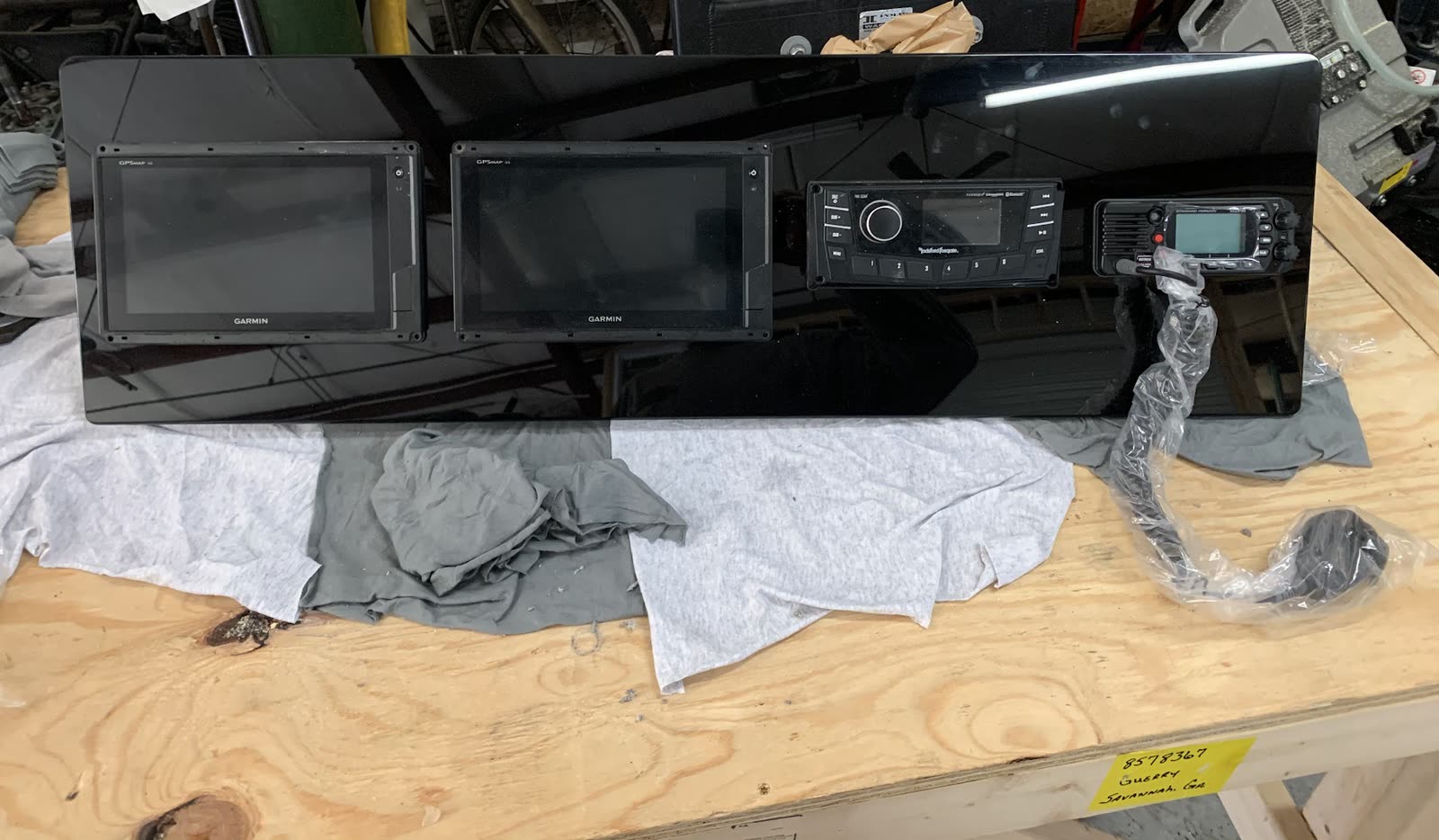 Before: Custom dash panel with displays and radios mounted, on the workbench