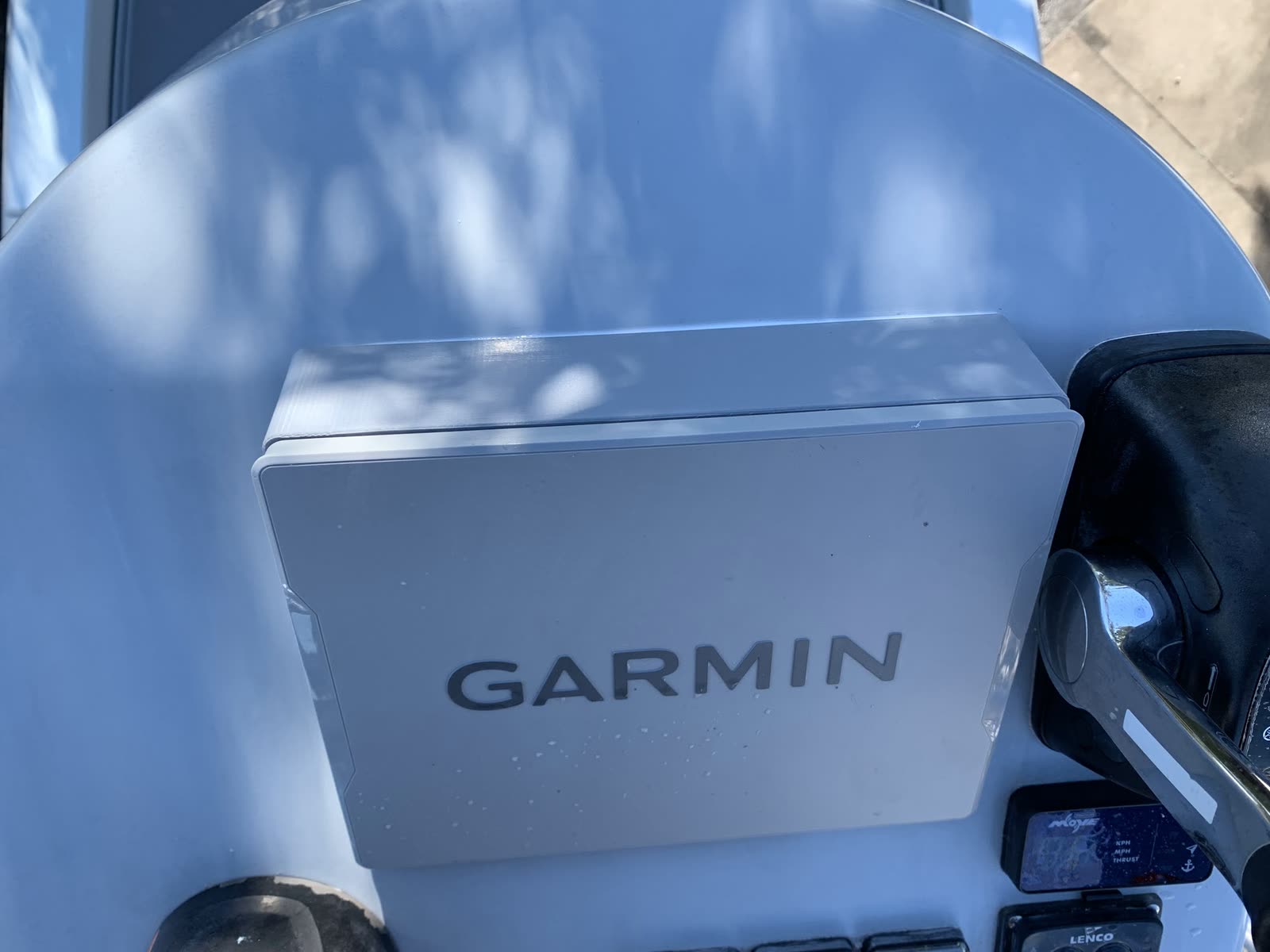 Close-up of a 3D-printed helm pod with switches and trim tab control