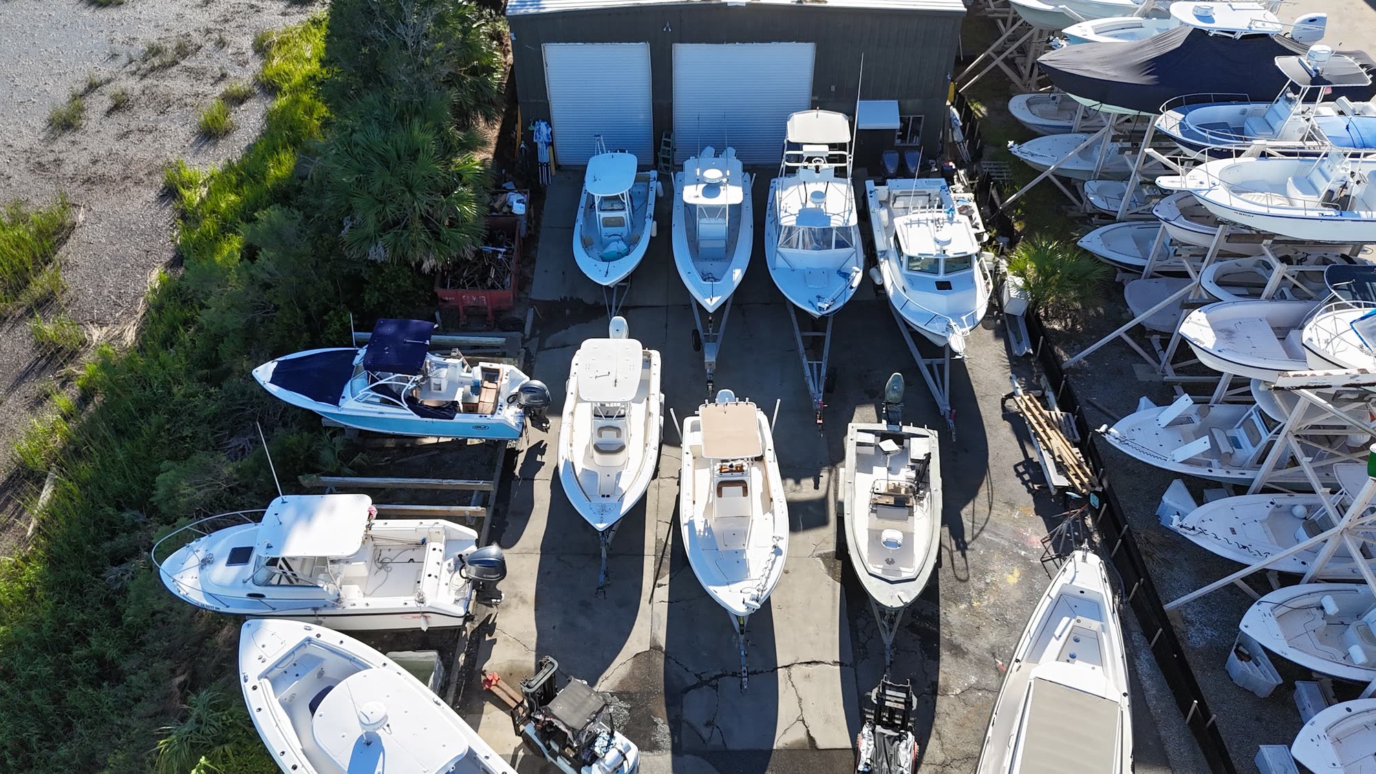 Aerial view of the Dolan Yacht Services shop with customer boats lined up in the yard